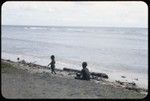 Woman and child on beach