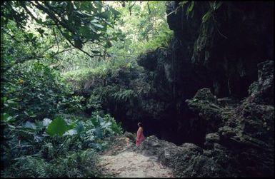 Woman wearing pink in forest