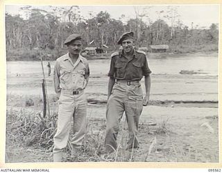 MIVO RIVER, BOUGAINVILLE, 1945-08-29. AFTER JAPANESE ENVOYS HAD OPENED SURRENDER NEGOTIATIONS ON 1945-08-18, AN AUSTRALIAN CAMP, UNDER MAJOR K.V.L. KESTEVEN, 15 INFANTRY BATTALION, AND A JAPANESE ..