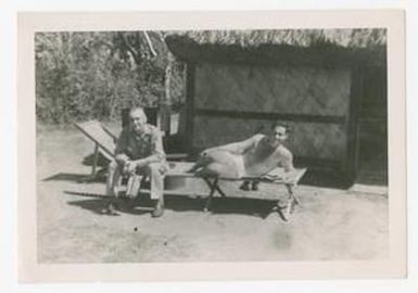 [Soldiers Lounge Outside a Hut]