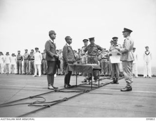 AT SEA OFF RABAUL, NEW BRITAIN. 1945-09-06. LIEUTENANT GENERAL V.A.H. STURDEE, GENERAL OFFICER COMMANDING FIRST ARMY TALKING TO GENERAL H. IMAMURA, COMMANDER EIGHTH AREA ARMY, AT THE SURRENDER ..