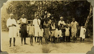 Group of Fijian men and children near Rewa, Fiji, 1928