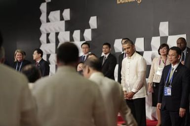 Barack Obama joins Asia Pacific Economic Cooperation Summit leaders and spouses for a group photo in Pasay, Metro Manila, Philippines, November 18, 2015