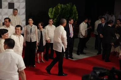 Barack Obama joins Asia Pacific Economic Cooperation Summit leaders and spouses for a group photo in Pasay, Metro Manila, Philippines, November 18, 2015
