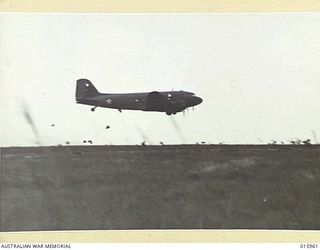 1943-10-08. NEW GUINEA. MARKHAM VALLEY. "BISCUIT BOMBERS" DROP RATIONS TO TROOPS IN THE FORWARD AREAS IN THE MARKHAM VALLEY. (NEGATIVE BY MILITARY HISTORY NEGATIVES)