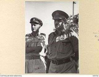 LAE AREA, NEW GUINEA. 1945-08-04. COLONEL I. WOOD, COMMANDING OFFICER, 2/7 GENERAL HOSPITAL (1) AND LIEUTENANT GENERAL B.M. MORRIS, GENERAL OFFICER COMMANDING ANGAU (2), AT THE ARTS AND CRAFTS ..