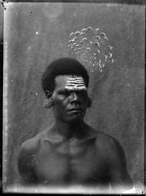 Man wearing Goura pigeon feathers, New Guinea, ca. 1929, 2 / Sarah Chinnery