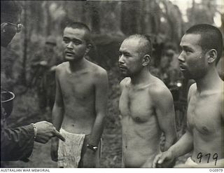 AITAPE AREA, NORTH EAST NEW GUINEA. C. 1944-04. THREE NAKED AND SCANTILY CLOTHED JAPANESE PRISONERS OF WAR (POWS) WHO WERE TAKEN BY AMERICAN INVASION FORCES AFTER THEIR LANDING AT KORAKO VILLAGE ..