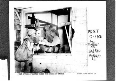 WORLD WAR II: POST OFFICE OPERATES UNDER THE SMOKE OF BATTLE - 4TH MARINE DIVISION