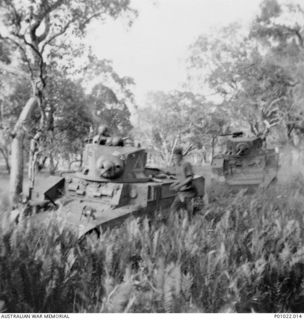 BRIBIE ISLAND, QLD, 1942. 2/4TH ARMOURED REGIMENT IN COMBINED OPERATIONS TRAINING WITH UNITED STATES TROOPS. THIS STUART M3A1 TANK IS BEING TESTED IN CONDITIONS THOUGHT TO BE SIMILAR TO THOSE AT ..