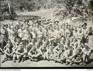 KIRIWINA, TROBRIAND ISLANDS, PAPUA. C. 1943-12. AIRMEN OF NO. 22 (BOSTON) SQUADRON RAAF, GROUP-UP FOR LUNCH AT THEIR CAMP AFTER A MORNINGS WORK AT THE AIRSTRIP