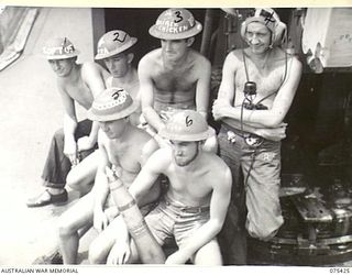 AT SEA. 1944-08-21. MEMBERS OF THE CRUISING WATCH ABOARD THE RAN FRIGATE, HMAS "BARCOO" WHILE ON THE WAY TO ALEXISHAFEN WITH TROOPS OF THE 30TH INFANTRY BATTALION