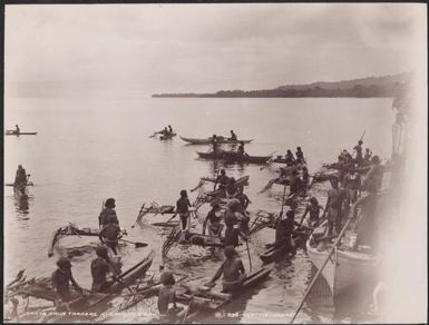 Solomon Islanders in canoes alongside the Southern Cross for trade at Graciosa Bay, Santa Cruz Islands, 1906, 1 / J.W. Beattie