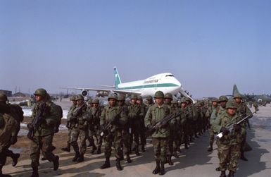 Troop of the 1ST Battalion, 5th Infantry, 25th Infantry Division, arrive at Osan Air Base from Schofield Barracks, Hawaii, to begin the joint Korean/United States training exercise TEAM SPIRIT '83