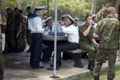 US Navy (USN) Sailors and Russian Sailors with the Russian Federated Navy (RFN) visiting the island of Guam (GU), at a Moral Welfare and Recreation-sponsored barbeque held at Gab Gab Beach at Naval Base (NB) Guam. The Sailors are mixing as they participate in PASSEX 06, an exercise designed to increase interoperability between the two navies while enhancing the strong cooperative relationship between Russia and the United States