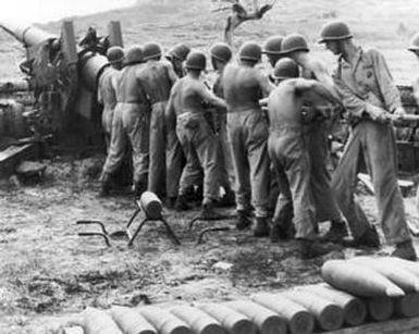 [Marine Rifle Crew Swabbing A Gun]