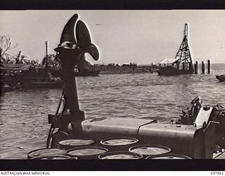 LAE, NEW GUINEA. 1943-10-12. CLOSE UP OF ONE OF THE RETRACTABLE SCREWS AND MOTORS OF THE 50 TON FLOATING CRANE, PD.240, OPERATED BY THE UNITED STATES SMALL SHIPS SECTION