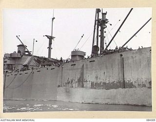 CUTARP PLANTATION, JACQUINOT BAY, NEW BRITAIN. 1944-12-15. THE TROOPSHIP FRANCIS PARKMAN ARRIVING OFF CUTARP PLANTATION CARRYING 19 INFANTRY BATTALION TROOPS