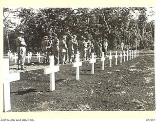 LAE, NEW GUINEA. 1944-04-23. MEMBERS OF THE AUSTRALIAN ARMY NURSING SERVICE FROM THE 2/7TH GENERAL HOSPITAL INSPECTING A SECTION OF THE LAE WAR CEMETERY AT THE CONCLUSION OF THE DEDICATION CEREMONY ..