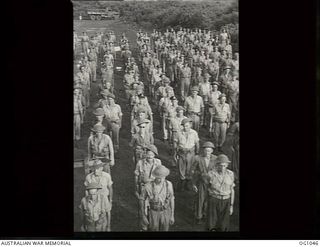 KIRIWINA, TROBRIAND ISLANDS, PAPUA. C. 1944-03. GROUP PORTRAIT OF AIRMEN OF NO. 30 (BEAUFIGHTER) SQUADRON RAAF ON COMMANDING OFFICER'S PARADE