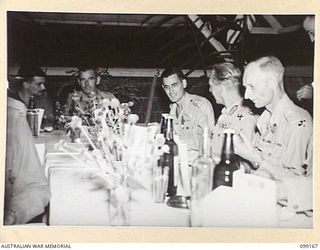 LAE, NEW GUINEA, 1945-12-01. MAJOR-GENERAL H.C.H. ROBERTSON, GENERAL OFFICER COMMANDING FIRST ARMY (4) AND COLONEL G.H.S. MORAN, DEPUTY DIRECTOR OF ELECTRICAL AND MECHANICAL ENGINEERING, FIRST ARMY ..