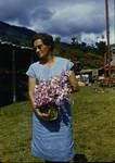 Woman holding orchids, Wau Show, 1959