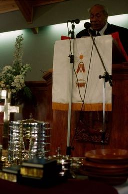 King Taufa'ahau Tupou IV speaking from the pulpit at the dedication of Vaine Mo'onia (The True Vine) church