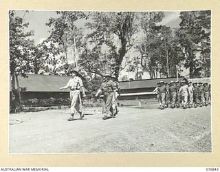 LAE, NEW GUINEA. 1944-11-11. THE COMMANDING OFFICER, VX104013 MAJOR I.A. WILSON (1) LEADING A MARCH OF THE STAFF AND PATIENTS OF THE 112TH CONVALESCENT DEPOT THROUGH THE UNIT LINES BEFORE ..