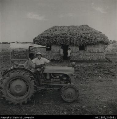 Famers on tractor with Field Officer