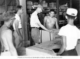 Researchers unpacking equipment the day after their arrival at Eniwetok, summer 1964