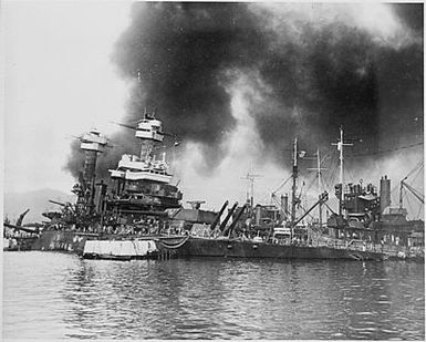 Naval photograph documenting the Japanese attack on Pearl Harbor, Hawaii which initiated US participation in World War II. Navy's caption: The sunken battleship USS CALIFORNIA after being hit by the Japanese during their sneak attack on Pearl Harbor on Dec. 7, 1941.