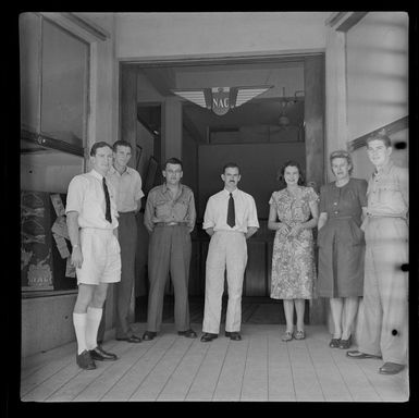 New Zealand National Airways Corporation, Suva, Fiji, D H McCaig, senior traffic officer Fiji (far left), J Gillon, traffic supervisor Auckland District (3rd left), T O'Connell, regional manager Suva (centre), S Jackson, space control British Commonwealth Pacific Airlines Sydney (far right)