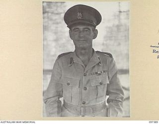 LAE, NEW GUINEA. 1945-10-04. BRIGADIER P.S. MCGRATH, DEPUTY DIRECTOR OF SUPPLY AND TRANSPORT, HEADQUARTERS FIRST ARMY