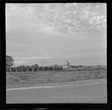 Nadi Airport, Fiji with a train hauling sugarcane wagons alongside
