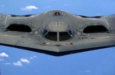 A U.S. Air Force B-2 Spirit"Stealth"bomber, 393rd Expeditionary Bomb Squadron, 509th Bomb Wing, Whiteman Air Force Base, Mo., flies over the Pacific Ocean after a recent aerial refueling mission, May 2, 2005. The Bombers are deployed to Anderson Air Force Base, Guam, as part of a rotation that has provided the U.S. Pacific Command a continous bomber presence in the Asian Pacific region since February 2004, enhancing regional security and the U.S. commitment to the Western Pacific. (U.S. Air Force photo by TECH SGT. Cecilio Ricardo) (Released)