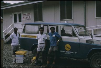 Our vehicle (Landcruiser previously converted to ambulance) with Jonathan Bbaloiloi, Adi'loi'i'nana (Joe) Ia'ia'mina and Hubert Murray Kirata : Bougainville Island, Papua New Guinea, April 1971 / Terence and Margaret Spencer