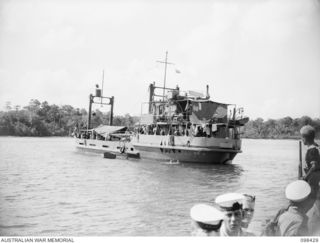 LOSSUK BAY, NEW IRELAND. 1945-10-19. THE AUSTRALIAN SUPPLY SHIP, EMILY (AV2075), WITH 200 TONS OF STORES FOR THE ANGAU ADMINISTRATIVE HEADQUARTERS, TO BE SET UP AT KAVIENG TO OPERATE IN NEW IRELAND ..