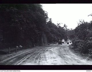 RABAUL, NEW BRITAIN, 1946-03-22. A PORTION OF THE FINISHED ROAD CONSTRUCTED BY MEMBERS OF 51 FIELD PARK COMPANY, ROYAL AUSTRALIAN ENGINEERS, READY FOR HEAVY VEHICULAR TRAFFIC