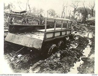 CAPE GLOUCESTER AREA, NEW BRITAIN, 1944-03-07. THIS PHOTO GIVES SOME IDEA OF THE TRANSPORT PROBLEMS THAT CONFRONTED THE FIRST TROOPS TO ARRIVE IN THIS AREA. THE ROAD IS IN THE OPERATIONAL AREA OF ..