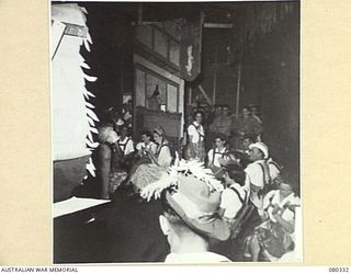 LAE, NEW GUINEA. 1944-08-01. THE OPENING SCENE VIEWED FROM THE WINGS DURING THE PRODUCTION OF "THE WHITE HORSE INN" BY STAFF AT THE 2/7TH GENERAL HOSPITAL, AUSTRALIAN ARMY MEDICAL CORPS