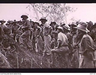 SOGERI VALLEY, NEW GUINEA. 1943-09-19. STUDENTS EXAMINING THE RESULTS OF THE TEST FIRING OF THE PROJECTOR INFANTRY TANK ATTACK MARK 1 AGAINST A JAPANESE PILLBOX. SHOWN: VX108988 CORPORAL E. F. ..