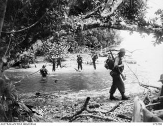 WEBER POINT, NEW GUINEAS, 1944-02-09. "D" COMPANY, 30TH INFANTRY BATTALION MEMBERS CROSSING THE RIVER NEAR WEBER POINT, IN THE ADVANCE FROM ROINJI (2) TO LINK WITH AMERICAN TROOPS AT YAGOMAI. ..