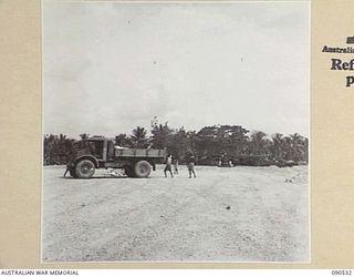 JACQUINOT BAY, NEW BRITAIN. 1945-04-12. RAAF ENGINEERS AT WORK BUILDING PLANE DISPERSAL BAYS AT THE AIRSTRIP