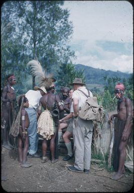 On the road, the doctor, his wife and the anthropologist discussing direction on the way to a village for information : Wahgi Valley, Papua New Guinea, 1954 and 1955 / Terence and Margaret Spencer