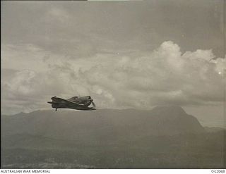 IN FLIGHT OVER BOUGAINVILLE ISLAND, SOLOMON ISLANDS. 1945-01-17. ACTING AS PATHFINDERS TO LOCATE AND MARK TARGETS, AUSTRALIAN BUILT BOOMERANG AIRCRAFT OF NO. 5 (ARMY CO-OPERATION) SQUADRON RAAF ..