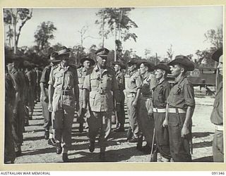 TOROKINA, BOUGAINVILLE. 1945-04-28. MAJOR GENERAL C.H. SIMPSON, SIGNAL OFFICER IN CHIEF, (2), INSPECTING A PARADE OF B CORPS SIGNALS, 2 CORPS, DURING HIS VISIT TO BOUGAINVILLE TO INSPECT SIGNAL ..