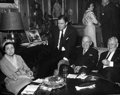 Former President Harry S. Truman during a visit to the Pauley's, with guests