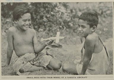 Small boys with their model of a Dakota aircraft