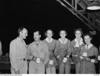 1943-05-05. NEW GUINEA. NURSES HOLD A DANCE. NURSES ARE SISTERS G. GAGGIN OF FORBES N.S.W., E. BOUGAN OF MORUYA N.S.W. M. EWING OF TOOWOOMBA QLD F. MCDONALD, ADELAIDE, SOUTH AUSTRALIA. (NEGATIVE BY ..