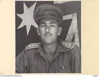 CAPE WOM, WEWAK AREA, NEW GUINEA. 1945-10-17. CAPTAIN G.N. FISHER, DEPUTY ADJUTANT GENERAL (LEARNER), HEADQUARTERS 6 DIVISION